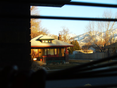 Sunset on the Neighbor's House by Laura Moncur 03-01-06